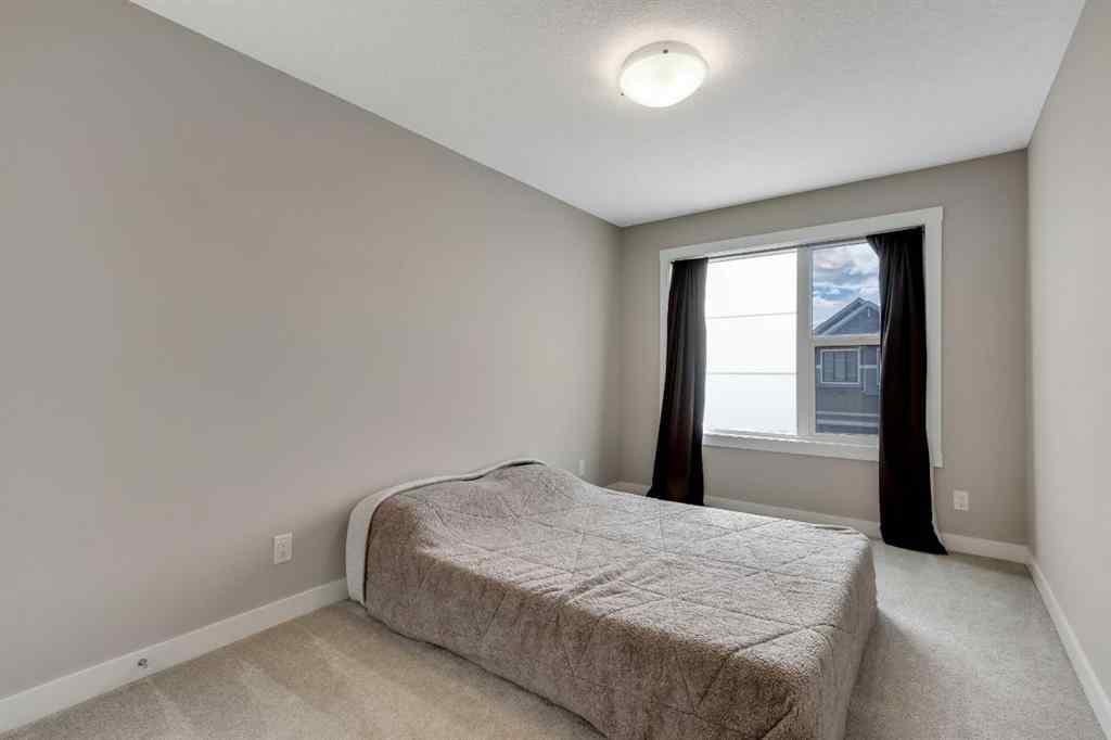 MLS® A2265104 - 216 Creekstone Row SW in Pine Creek Calgary, Residential