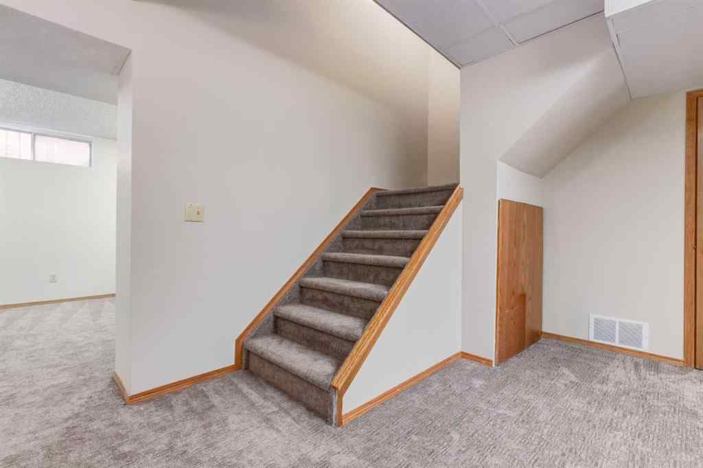 MLS® A2265153 - 39 Canterbury Court SW in Canyon Meadows Calgary, Residential