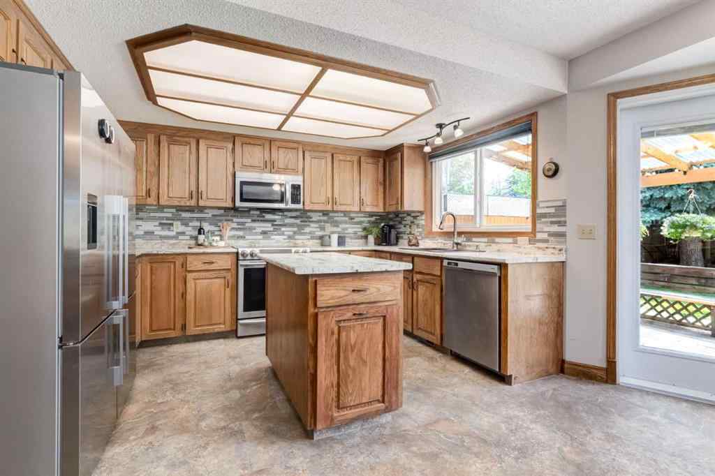 MLS® A2265153 - 39 Canterbury Court SW in Canyon Meadows Calgary, Residential