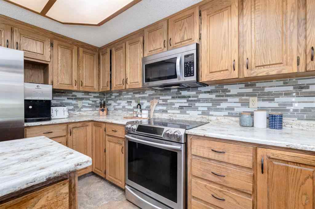 MLS® A2265153 - 39 Canterbury Court SW in Canyon Meadows Calgary, Residential