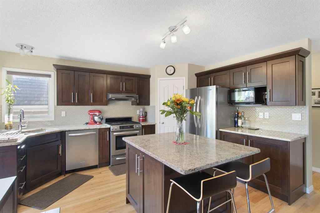 MLS® A2265193 - 38 Spring Crescent SW in Springbank Hill Calgary, Residential
