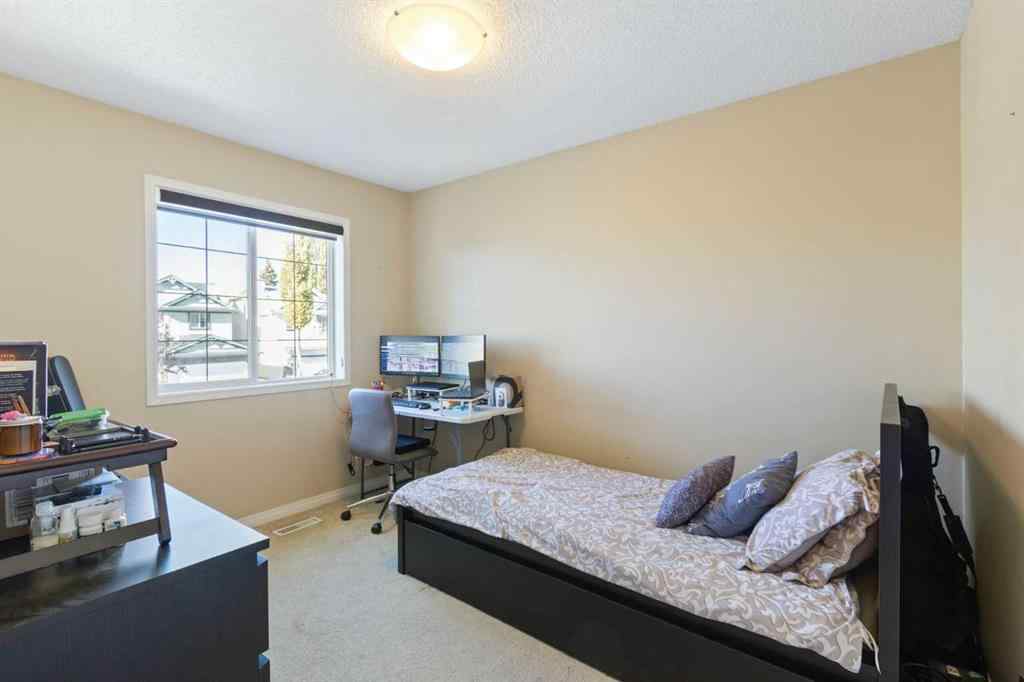 MLS® A2265193 - 38 Spring Crescent SW in Springbank Hill Calgary, Residential