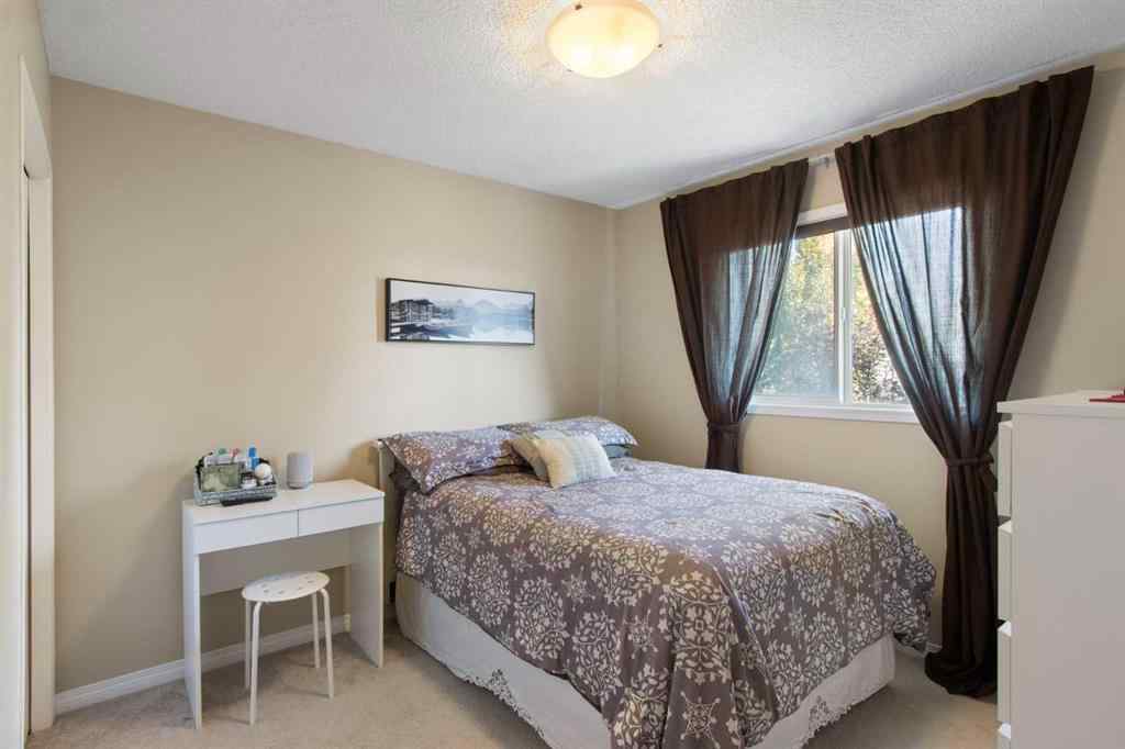 MLS® A2265193 - 38 Spring Crescent SW in Springbank Hill Calgary, Residential