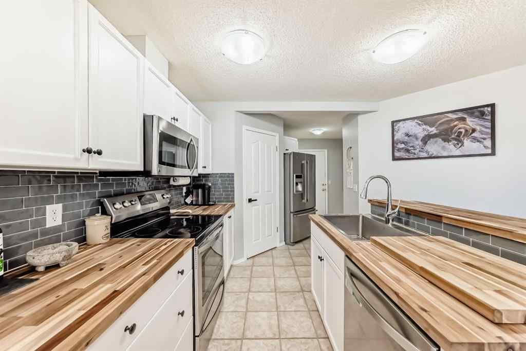 MLS® A2265241 - Unit #8 122 Bow Ridge Crescent  in Bow Ridge Cochrane, Residential
