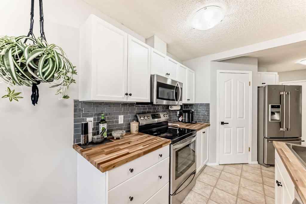 MLS® A2265241 - Unit #8 122 Bow Ridge Crescent  in Bow Ridge Cochrane, Residential