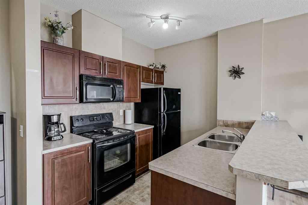 MLS® A2265312 - Unit #401 1727 54 Street SE in Penbrooke Meadows Calgary, Residential