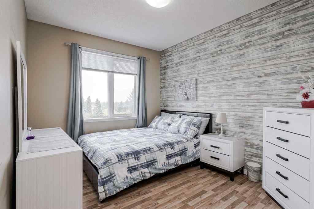 MLS® A2265312 - Unit #401 1727 54 Street SE in Penbrooke Meadows Calgary, Residential
