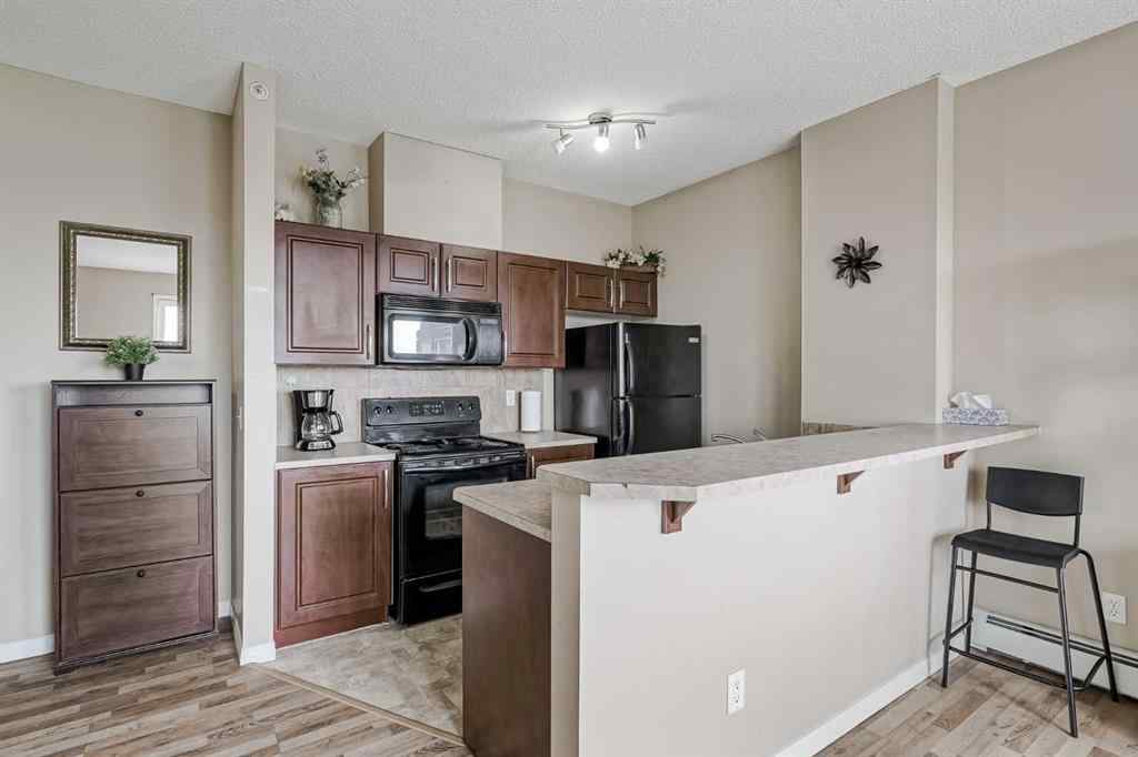 MLS® A2265312 - Unit #401 1727 54 Street SE in Penbrooke Meadows Calgary, Residential
