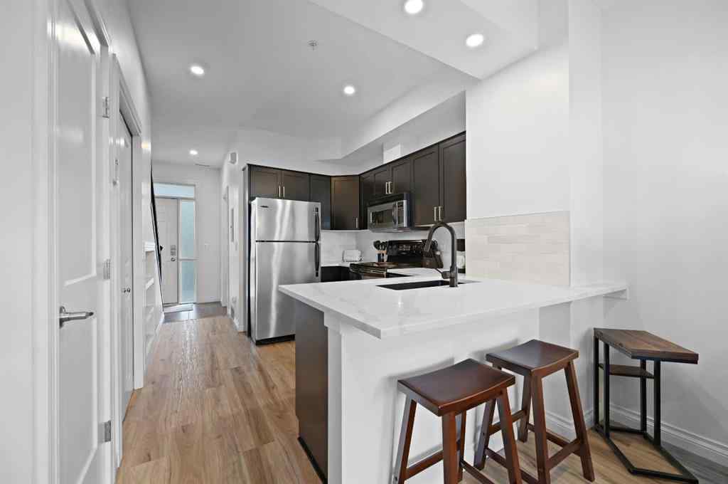 MLS® A2265358 - Unit #13 108 Rockyledge View NW in Rocky Ridge Calgary, Residential