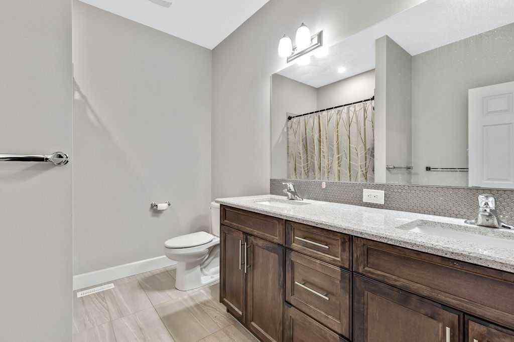 MLS® A2265425 - 165 Carrington Close NW in Carrington Calgary, Residential