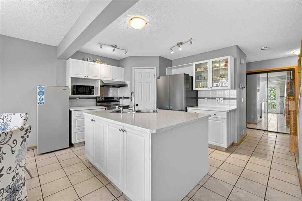 MLS&reg; # A2265441 - 64 Macewan Park Rise NW in MacEwan Glen Calgary, Residential Open Houses