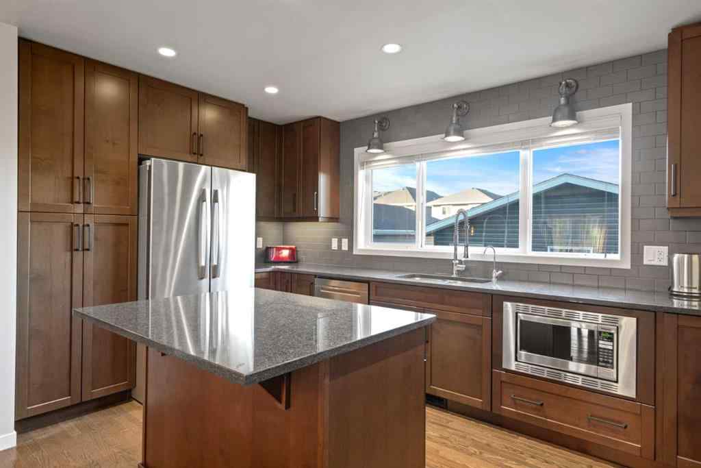 MLS® A2265442 - 219 River Heights Green  in River Song Cochrane, Residential