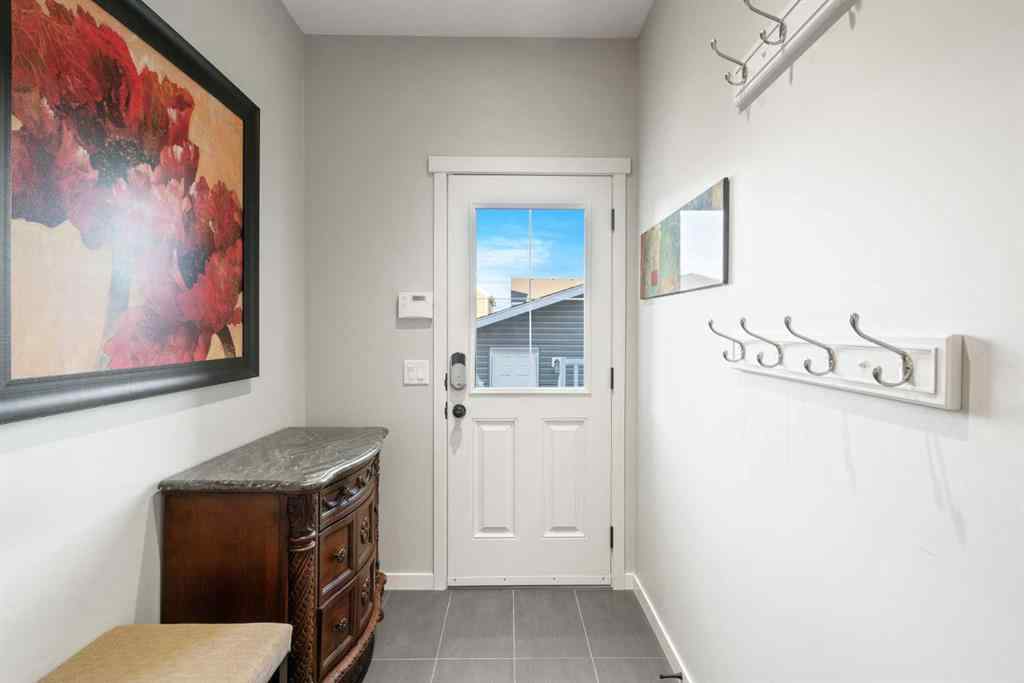 MLS® A2265442 - 219 River Heights Green  in River Song Cochrane, Residential