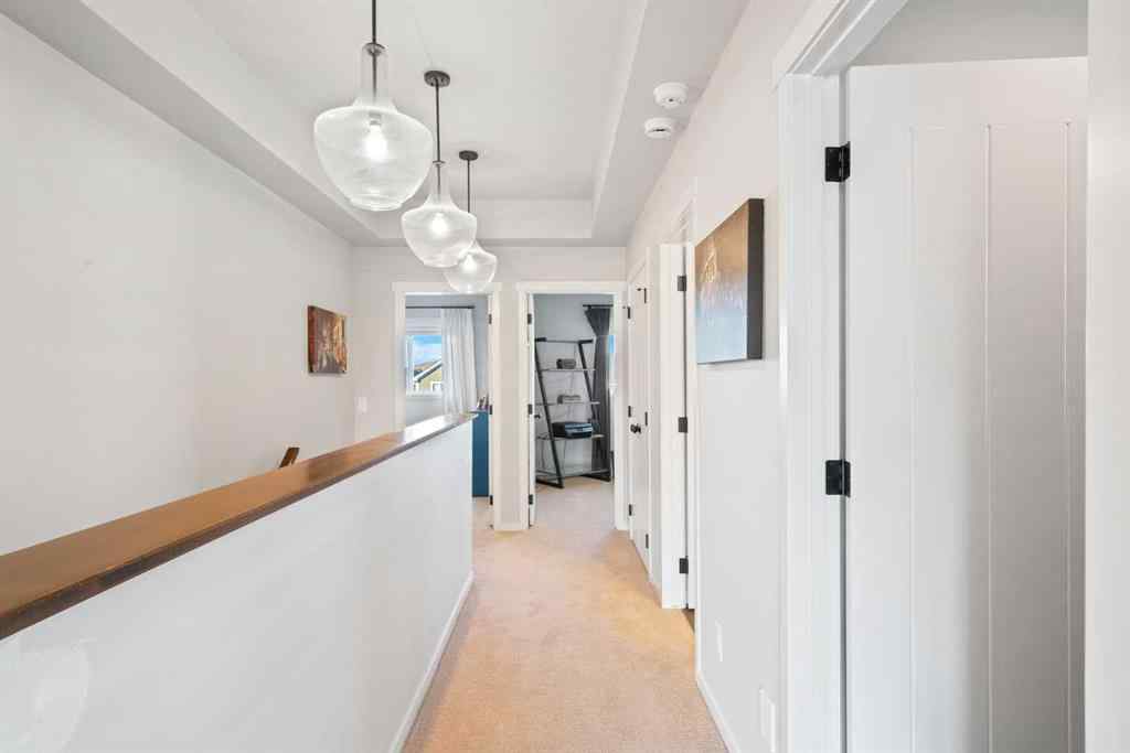 MLS® A2265442 - 219 River Heights Green  in River Song Cochrane, Residential