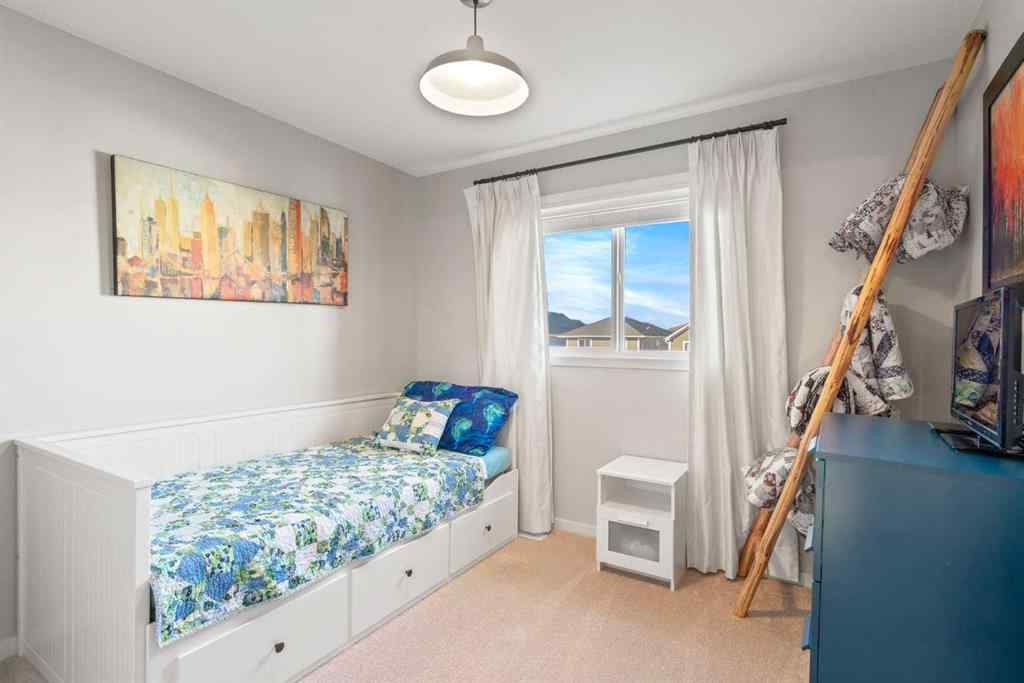 MLS® A2265442 - 219 River Heights Green  in River Song Cochrane, Residential