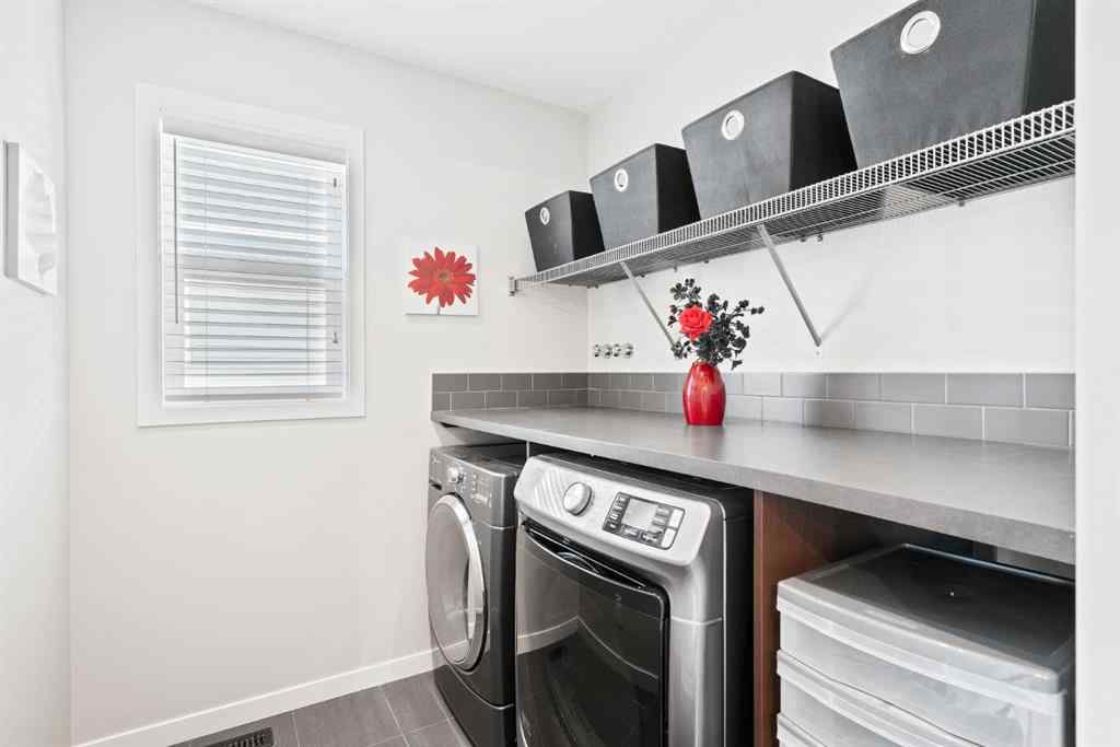 MLS® A2265442 - 219 River Heights Green  in River Song Cochrane, Residential