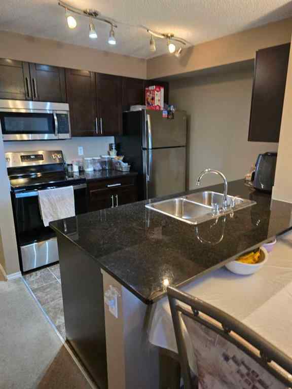 MLS® A2265505 - Unit #214 5 Saddlestone Way NE in Saddle Ridge Calgary, Residential