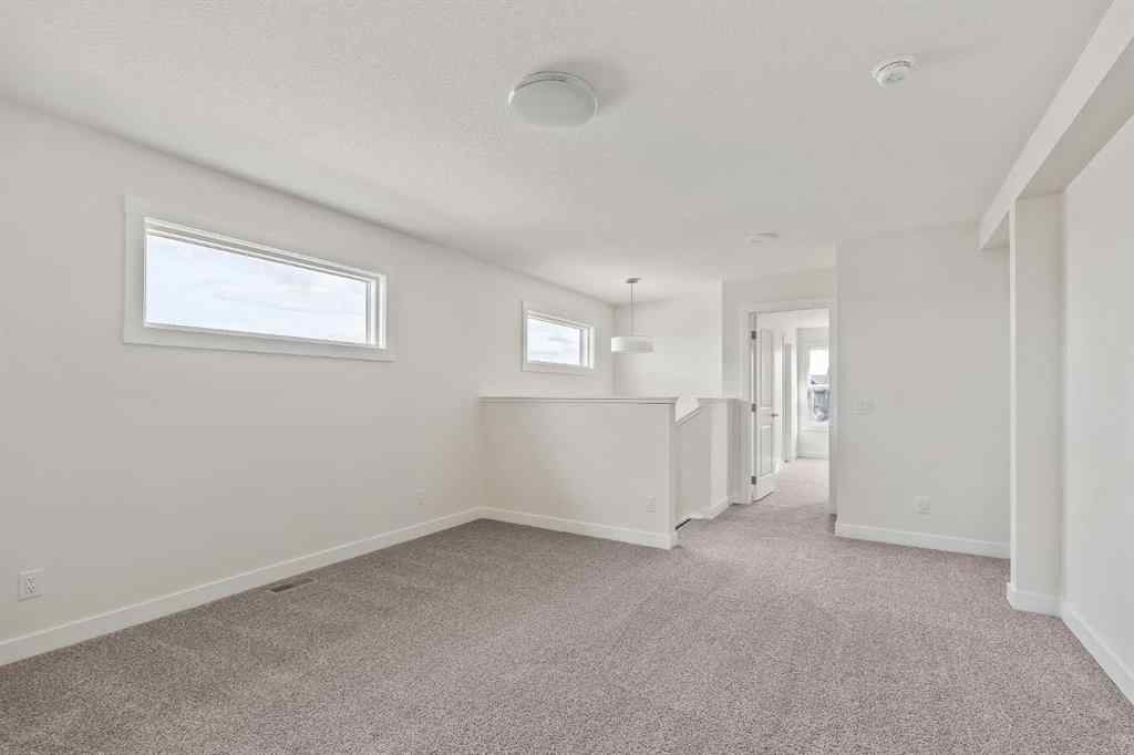 MLS® A2265521 - 10 Herron Common NE in Livingston Calgary, Residential