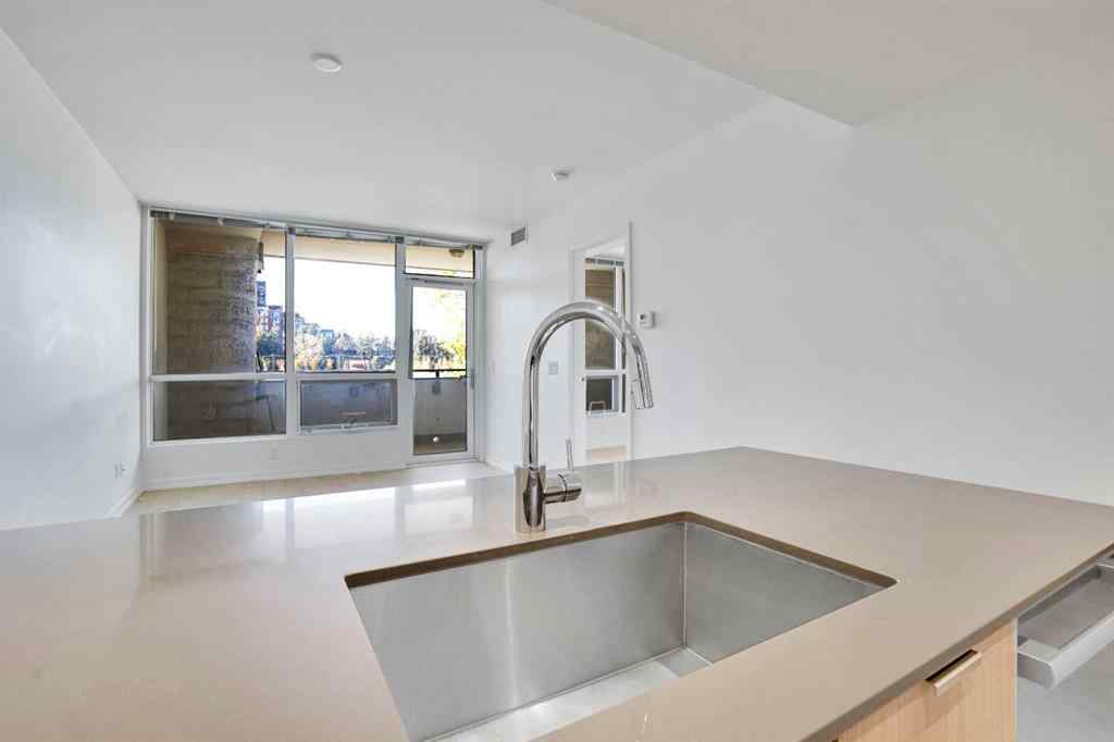 MLS® A2265532 - Unit #205 128 2 Street SW in Chinatown Calgary, Residential