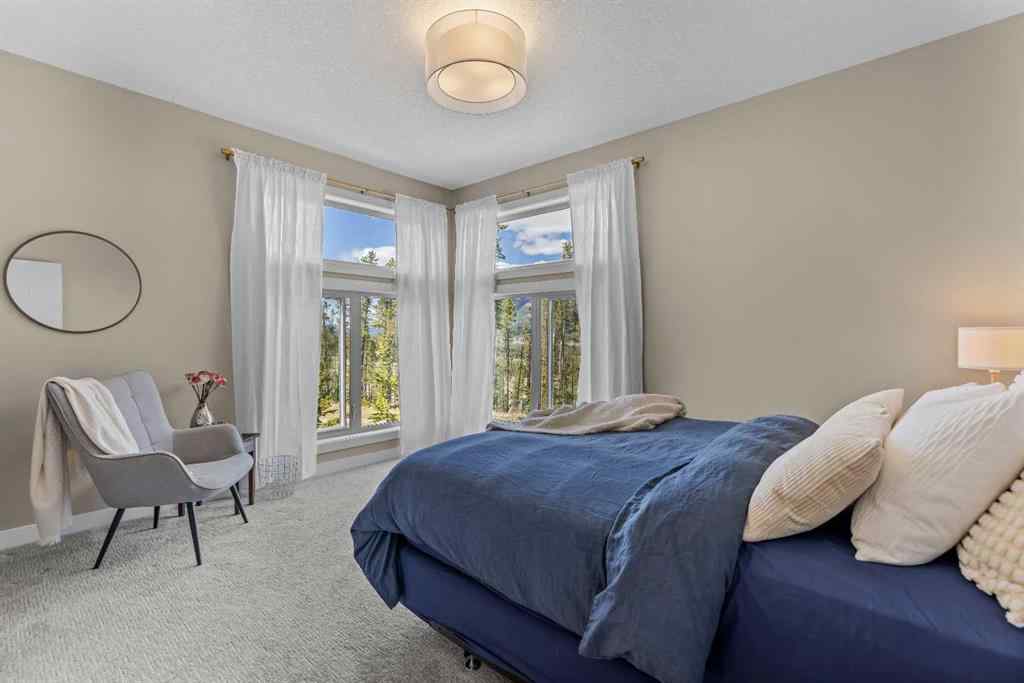 MLS® A2265553 - Unit #302 102 Stewart Creek Rise  in Three Sisters Canmore, Residential