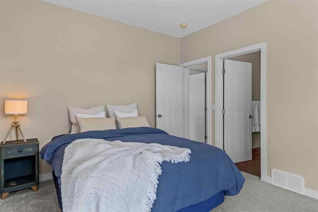 MLS® A2265553 - Unit #302 102 Stewart Creek Rise  in Three Sisters Canmore, Residential