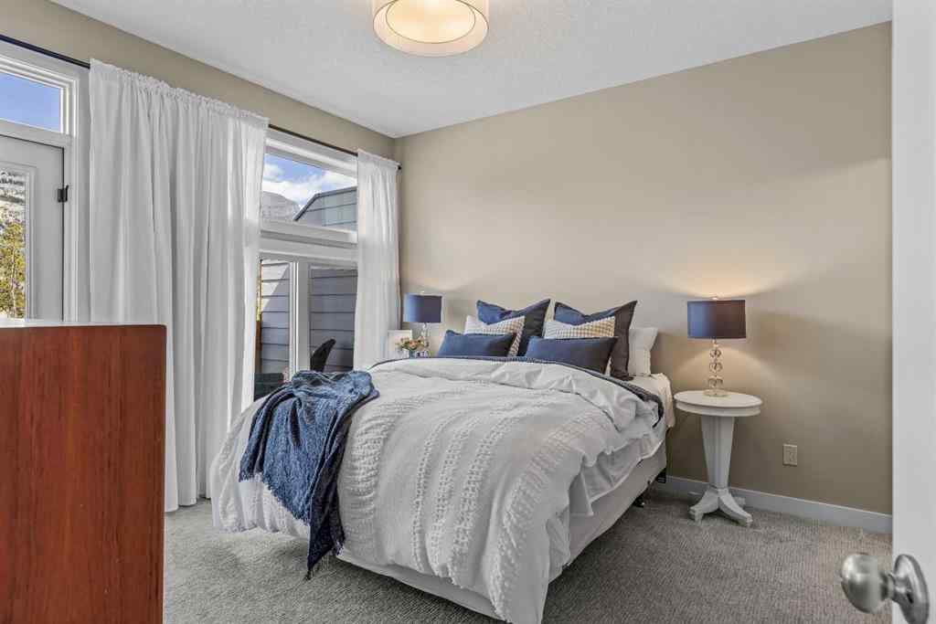 MLS® A2265553 - Unit #302 102 Stewart Creek Rise  in Three Sisters Canmore, Residential