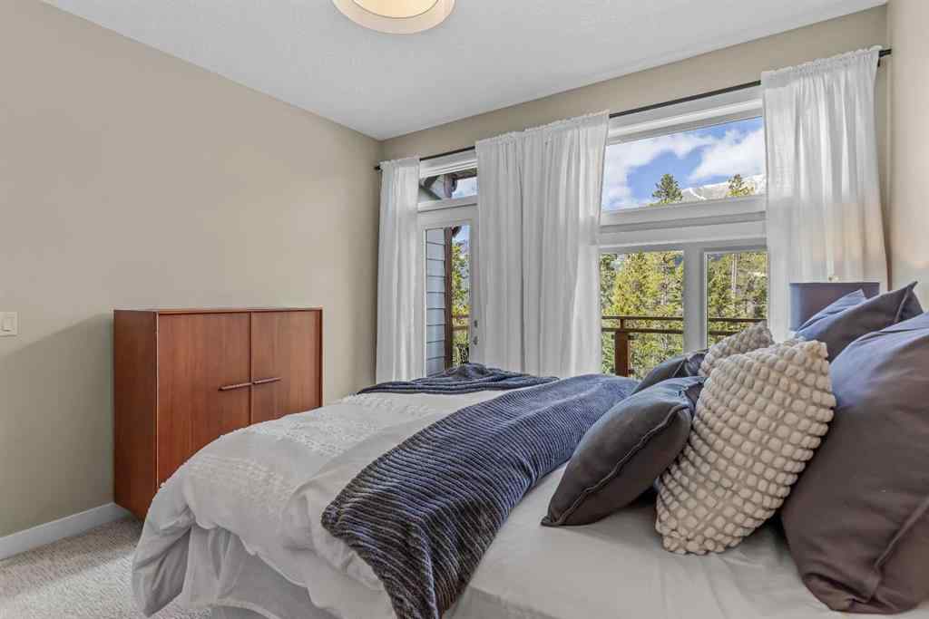 MLS® A2265553 - Unit #302 102 Stewart Creek Rise  in Three Sisters Canmore, Residential