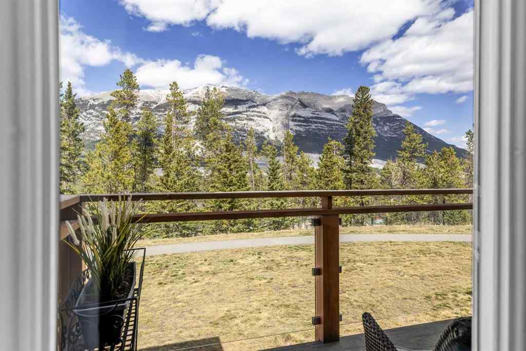 MLS® A2265553 - Unit #302 102 Stewart Creek Rise  in Three Sisters Canmore, Residential
