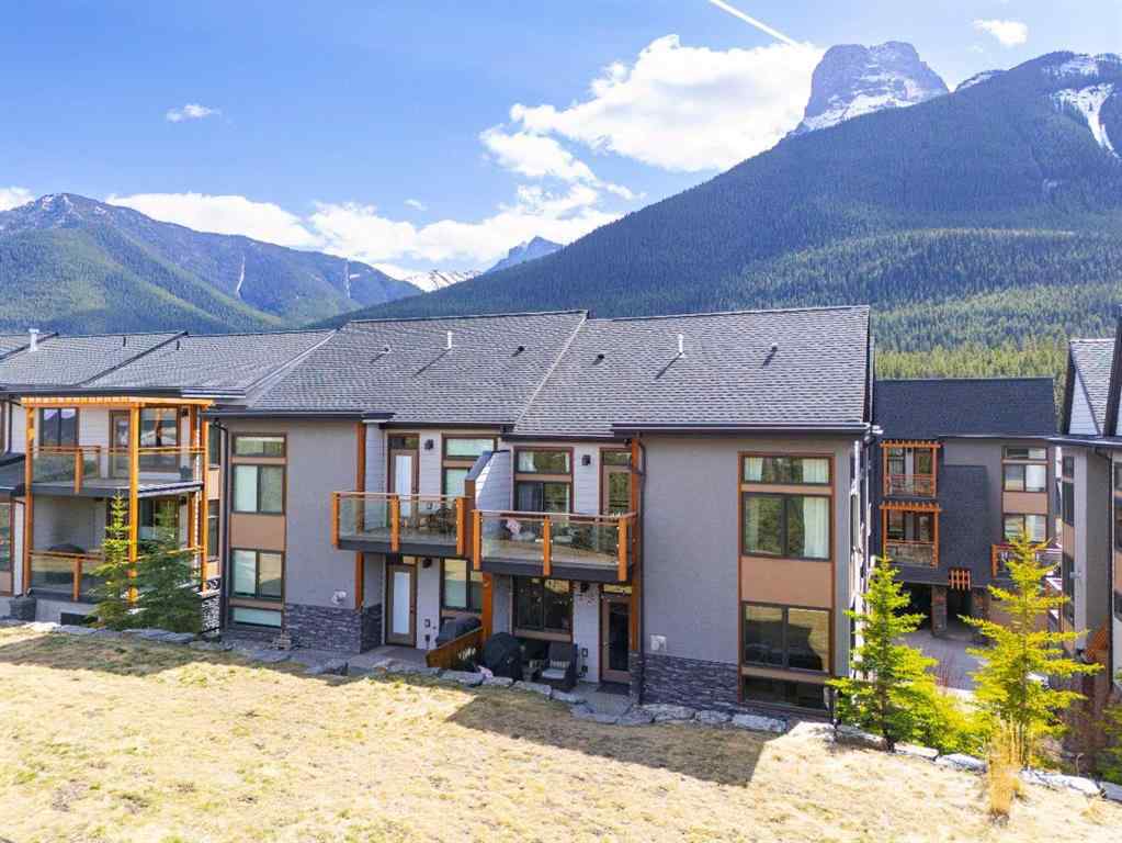 MLS® A2265553 - Unit #302 102 Stewart Creek Rise  in Three Sisters Canmore, Residential