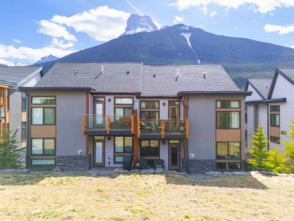 MLS® A2265553 - Unit #302 102 Stewart Creek Rise  in Three Sisters Canmore, Residential