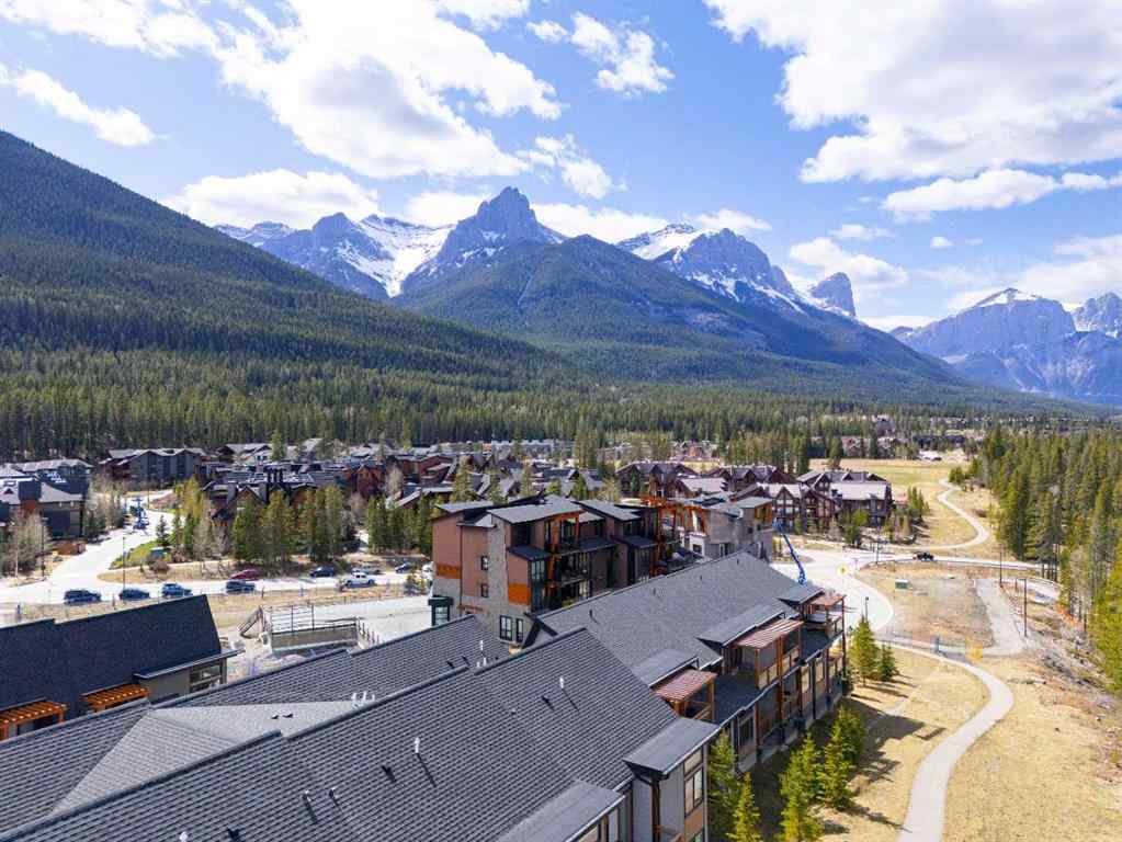MLS® A2265553 - Unit #302 102 Stewart Creek Rise  in Three Sisters Canmore, Residential