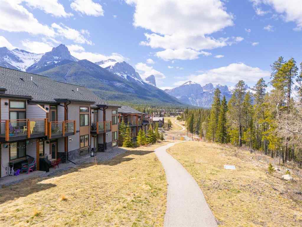 MLS® A2265553 - Unit #302 102 Stewart Creek Rise  in Three Sisters Canmore, Residential