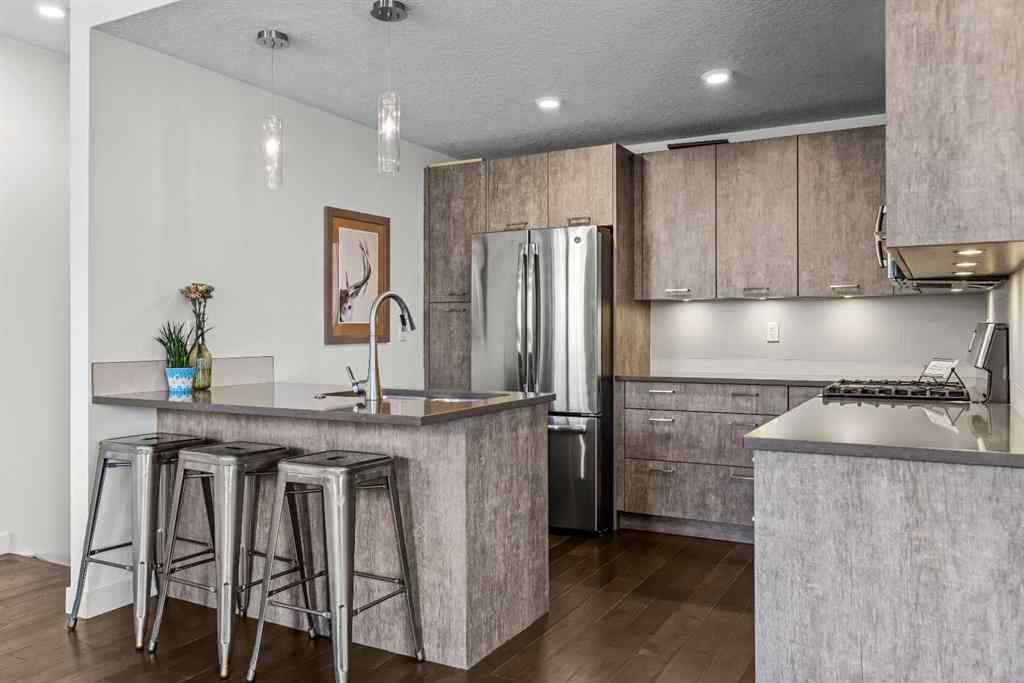 MLS® A2265553 - Unit #302 102 Stewart Creek Rise  in Three Sisters Canmore, Residential