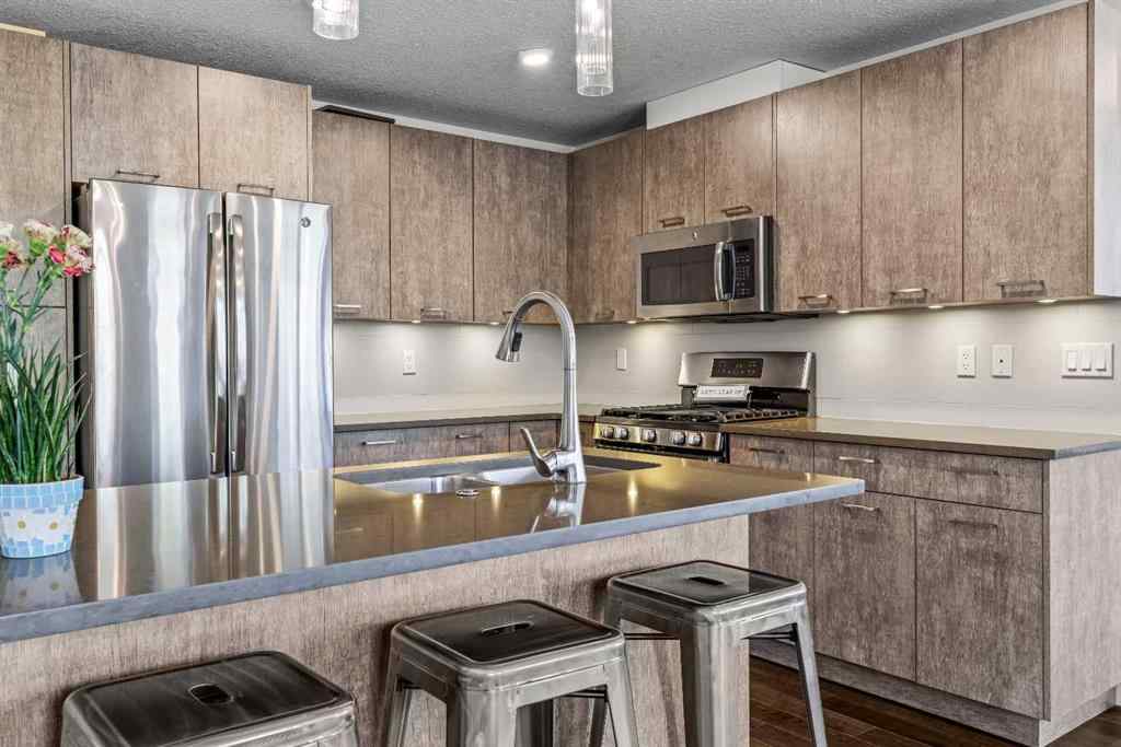 MLS® A2265553 - Unit #302 102 Stewart Creek Rise  in Three Sisters Canmore, Residential