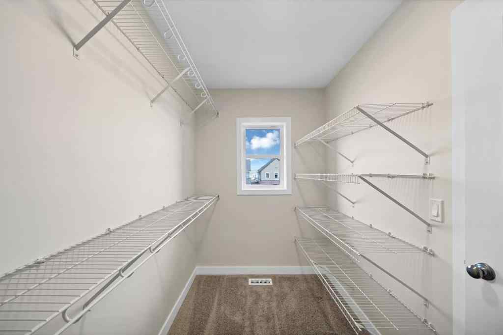 MLS® A2265590 - 5077 Harmony Circle  in Harmony Rural Rocky View County, Residential