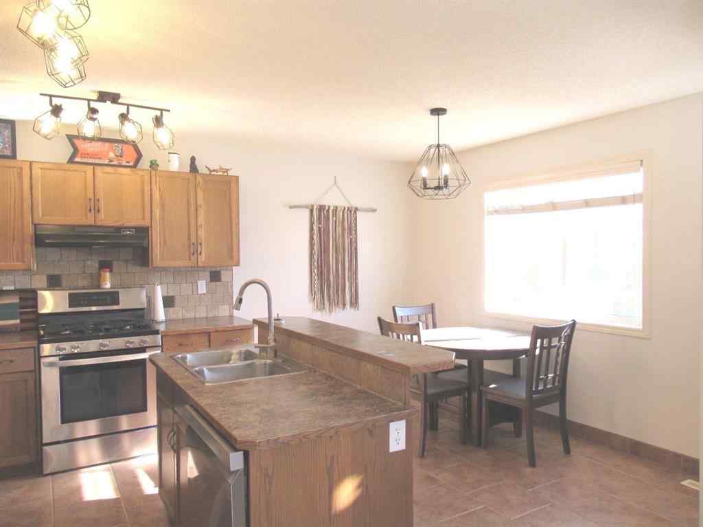 MLS® A2265627 - 105 Cimarron Park Circle  in Cimarron Okotoks, Residential