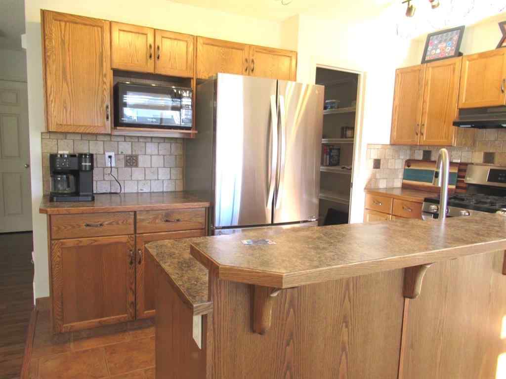 MLS® A2265627 - 105 Cimarron Park Circle  in Cimarron Okotoks, Residential