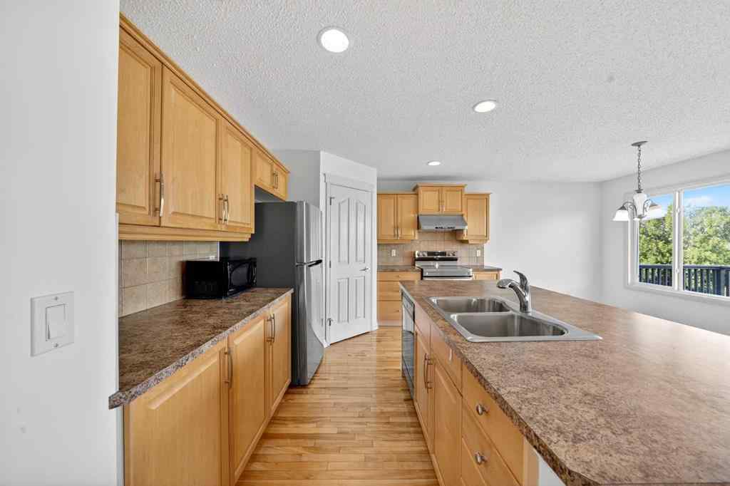 MLS® A2265634 - 320 Everbrook Way SW in Evergreen Calgary, Residential