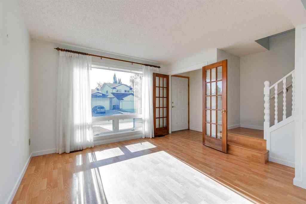 MLS® A2265651 - 76 Woodstock Road SW in Woodlands Calgary, Residential