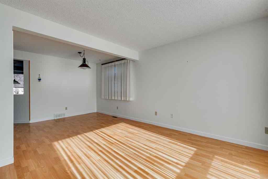 MLS® A2265651 - 76 Woodstock Road SW in Woodlands Calgary, Residential