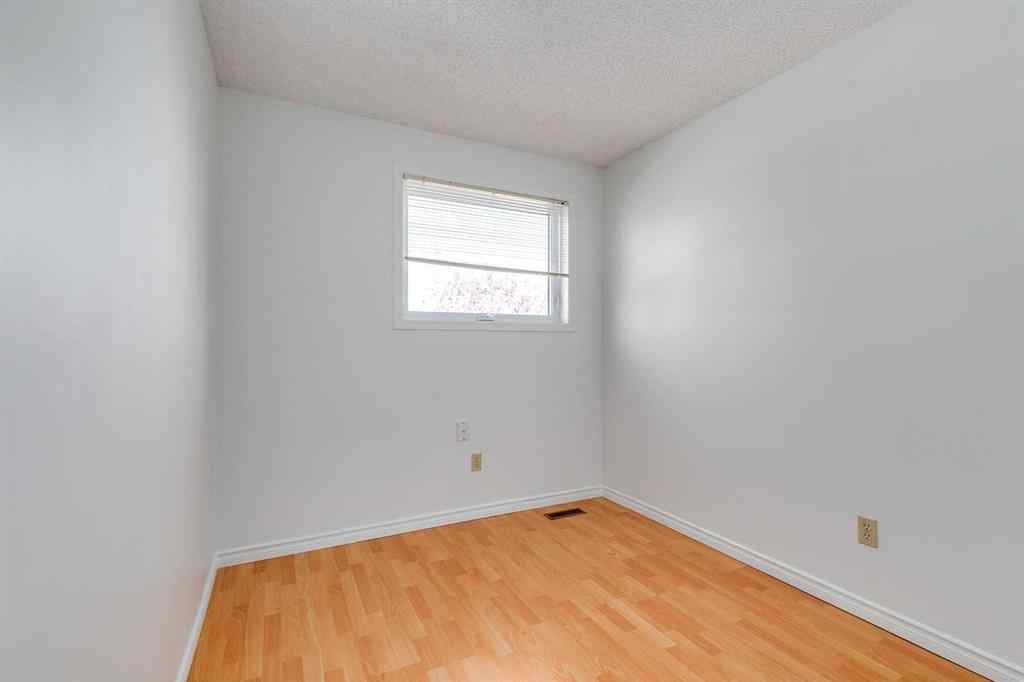 MLS® A2265651 - 76 Woodstock Road SW in Woodlands Calgary, Residential