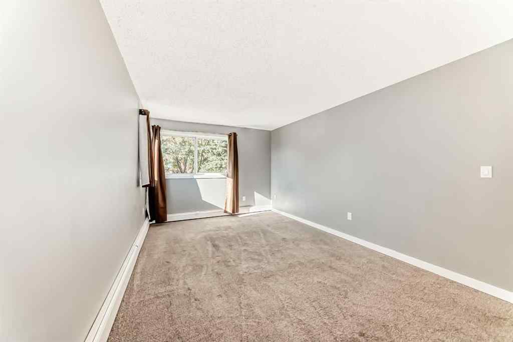 MLS® A2265746 - Unit #210 1001 68 Avenue SW in Kelvin Grove Calgary, Residential