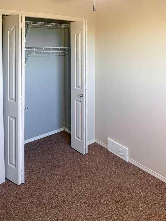 MLS® A2265842 - 7023 Deer Street  in College Heights Lacombe, Residential