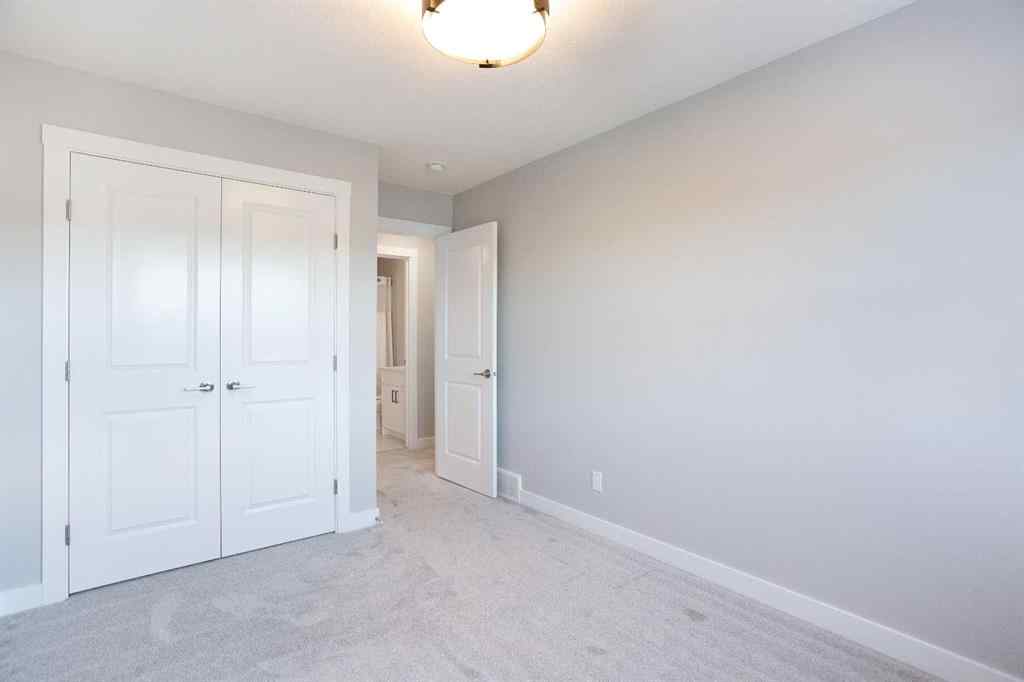 MLS® A2265852 - 125 Cranbrook Gardens SE in Cranston Calgary, Residential