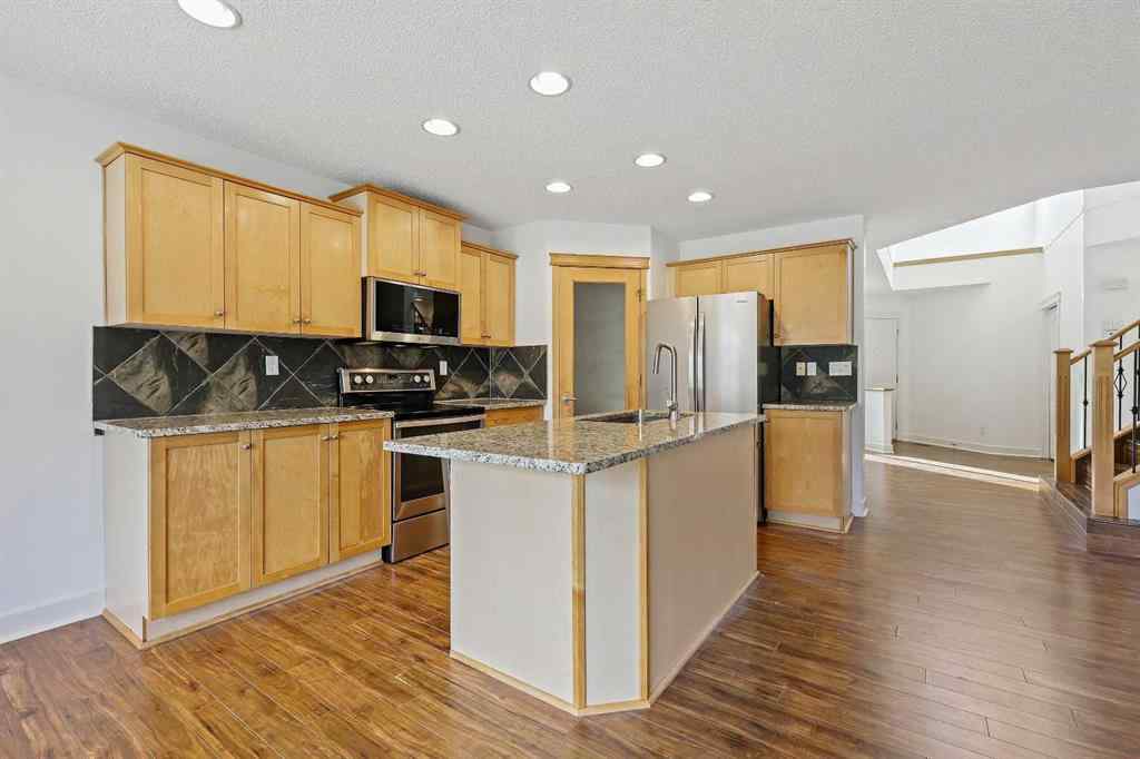 MLS® A2265903 - 7936 Springbank Boulevard SW in Springbank Hill Calgary, Residential