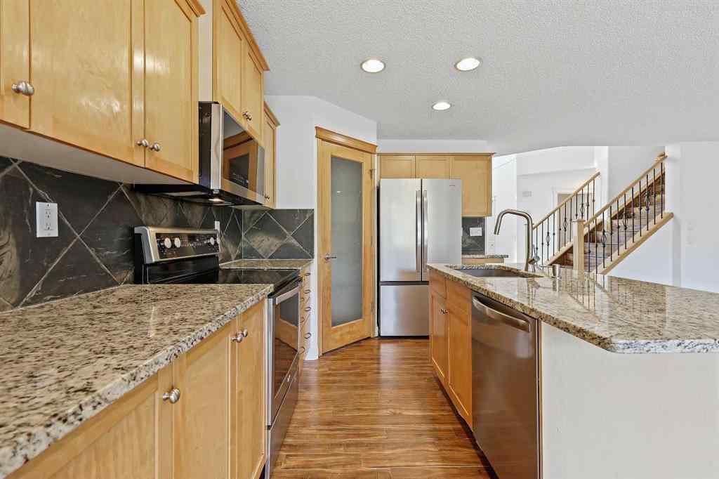 MLS® A2265903 - 7936 Springbank Boulevard SW in Springbank Hill Calgary, Residential