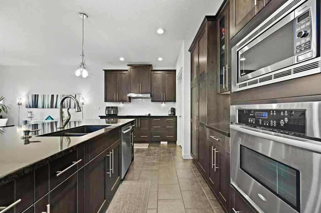MLS® A2265921 - 129 Springbluff Boulevard SW in Springbank Hill Calgary, Residential