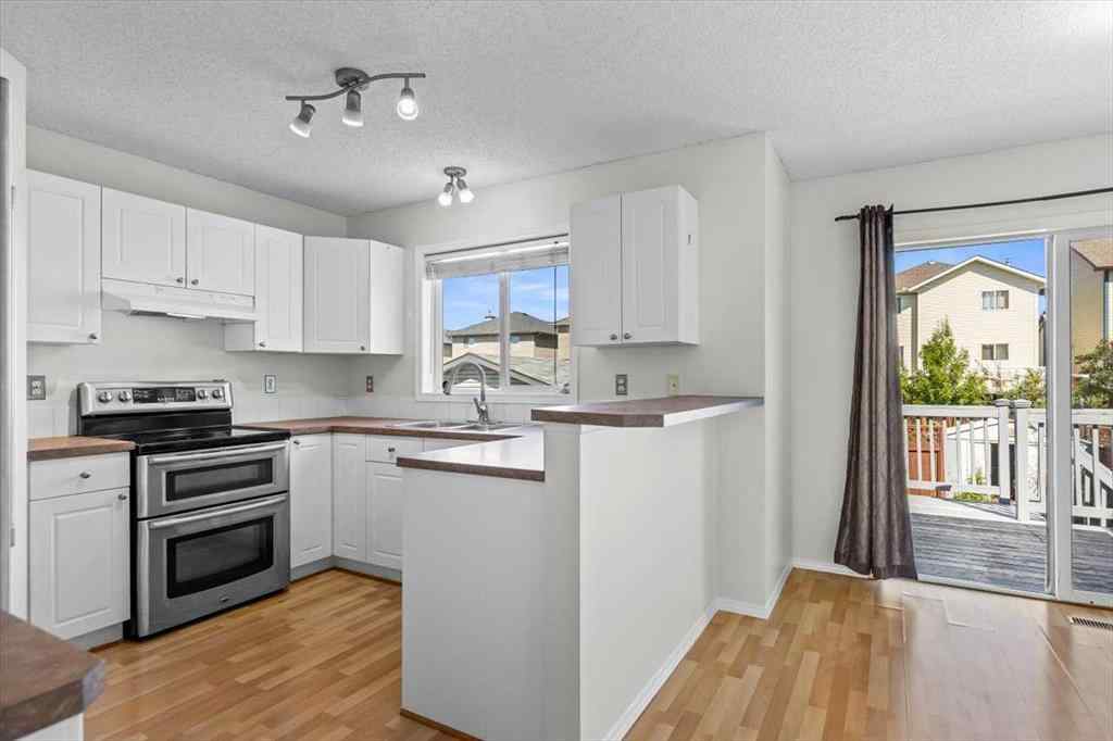 MLS® A2266005 - 911 Arbour Lake Road NW in Arbour Lake Calgary, Residential