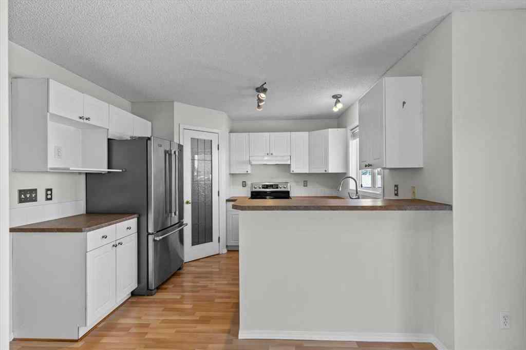 MLS® A2266005 - 911 Arbour Lake Road NW in Arbour Lake Calgary, Residential
