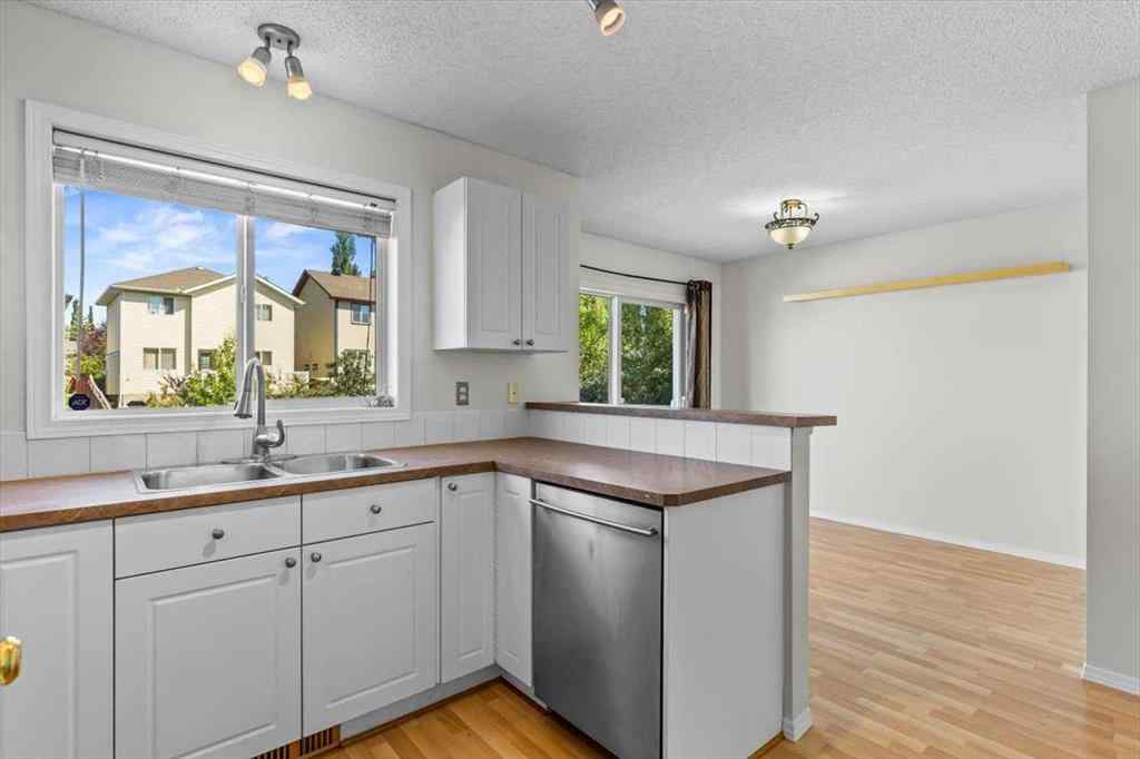 MLS® A2266005 - 911 Arbour Lake Road NW in Arbour Lake Calgary, Residential